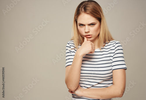 woman with angry facial expression striped t-shirt emotions Studio