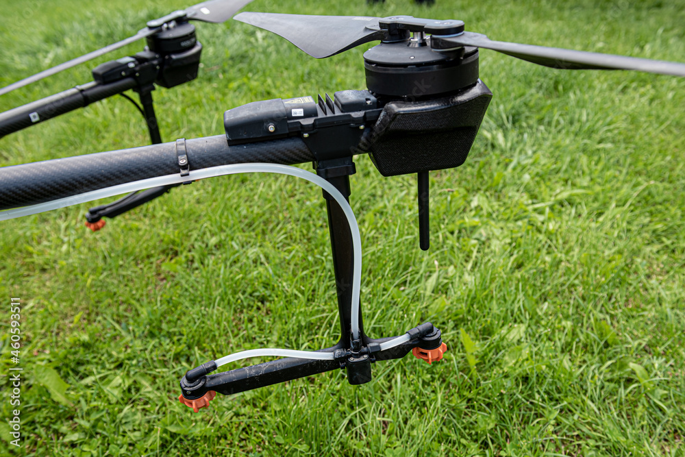 Professional agriculture drone on the green field Professional agriculture drone on the green field