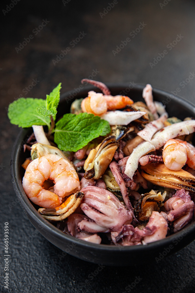 seafood mix shrimp, squid, mussel, rapan, octopus fresh portion ready to eat meal snack on the table copy space food background rustic. top view keto or paleo diet vegetarian food pescetarian diet seafood mix shrimp, squid, mussel, rapan, octopus fresh portion ready to eat meal snack on the table copy space food background rustic. top view keto or paleo diet vegetarian food pescetarian diet