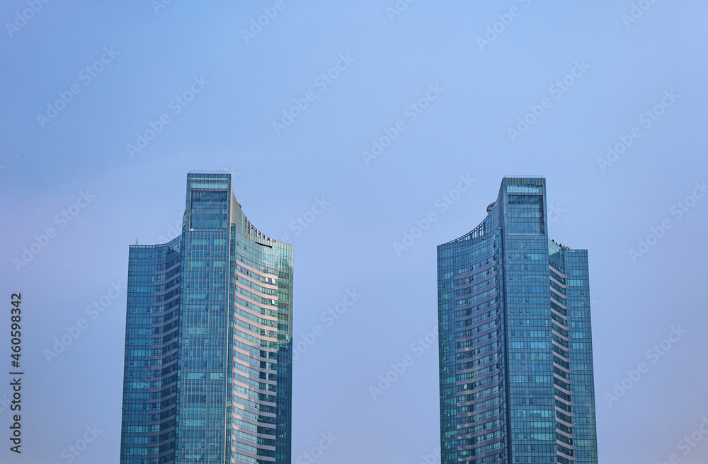 Twin Towers architecture with blue sky background
