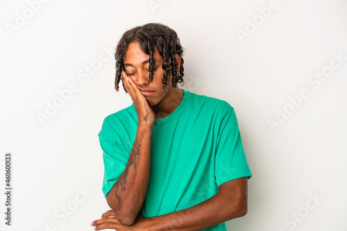 Young african american man isolated on white background who is bored, fatigued and need a relax day.