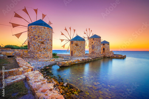 Fototapeta Naklejka Na Ścianę i Meble -  Old windmills by the beach, Chios island, Greece.