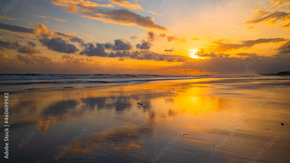 Sunset time. Seascape background. Bright sunlight. Sun at horizon line. Scenic view. Sunset golden hour. Sunlight reflection in water. Magnificent scenery. Copy space. Kelanting beach, Bali