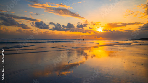Sunset time. Seascape background. Bright sunlight. Sun at horizon line. Scenic view. Sunset golden hour. Sunlight reflection in water. Beautiful nature. Copy space. Kelanting beach, Bali © Olga