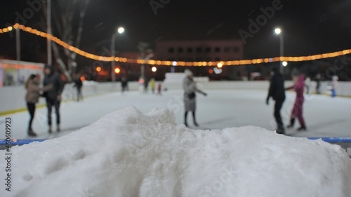 Blurred view of an outdoor ice rink in the city.