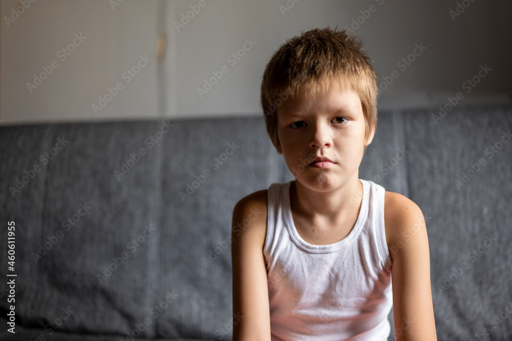 funny boy in white t-shirt and orange panties posing for camera on couch funny boy in white t-shirt and orange panties posing for camera on couch