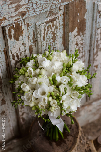 White freesia bridal bouquet on dark background. close up. Wedding bouquet. © Mihai