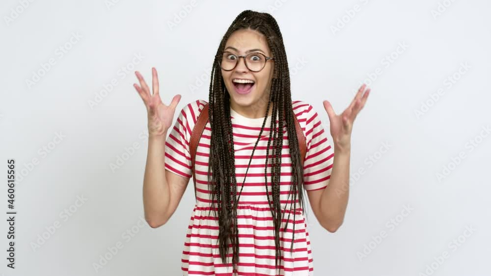 Teenager girl with braids with glasses with surprise and shocked facial expression over isolated background