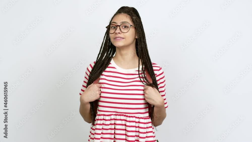 Teenager girl with braids with glasses looking side over isolated background Teenager girl with braids with glasses looking side over isolated background