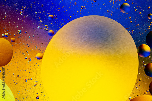 Abstract colorful background of oil circles. Oil in the water surface circles, water foam and oil bubbles.