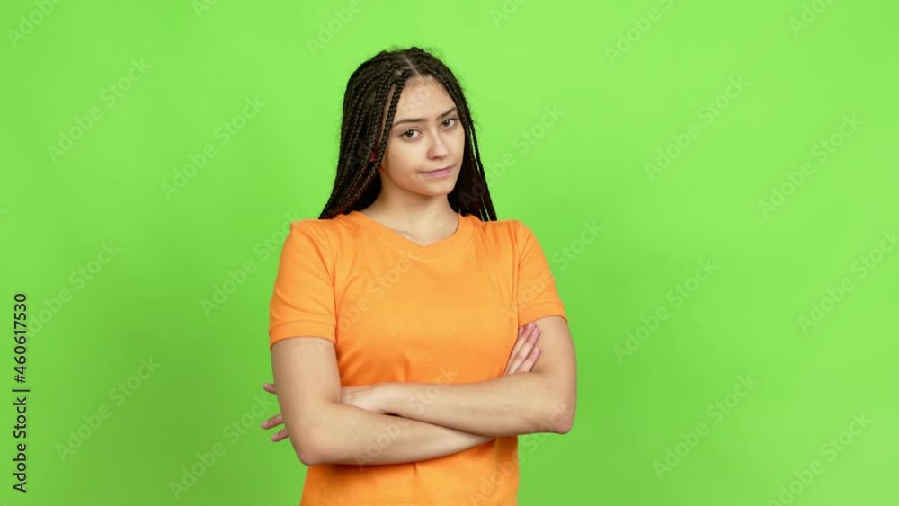 Teenager girl with braids making unimportant and doubts gesture while lifting the shoulders and the palms of the hands over isolated background Teenager girl with braids making unimportant and doubts gesture while lifting the shoulders and the palms of the hands over isolated background