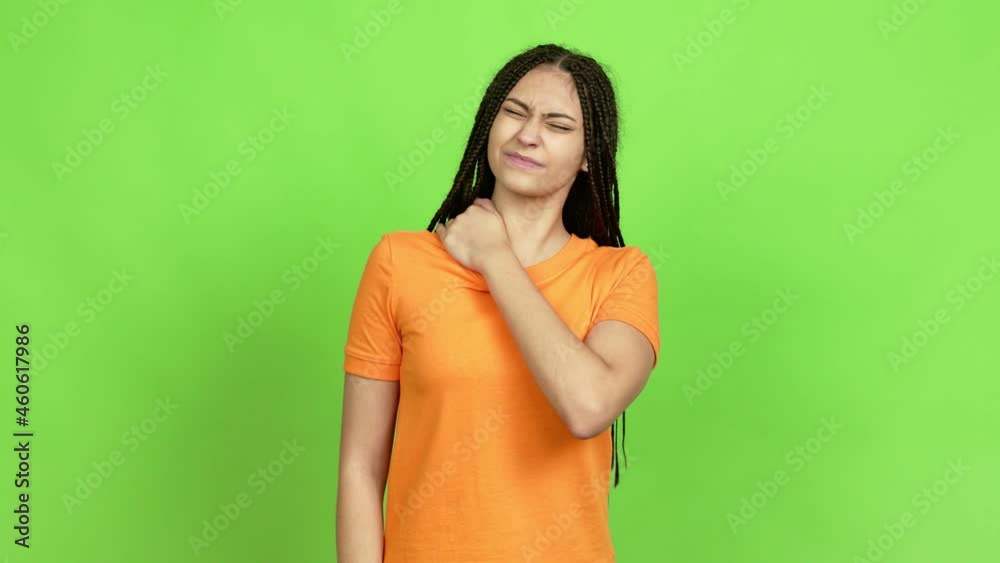 Teenager girl with braids with shoulder pain over isolated background. Green screen chroma key Teenager girl with braids with shoulder pain over isolated background. Green screen chroma key