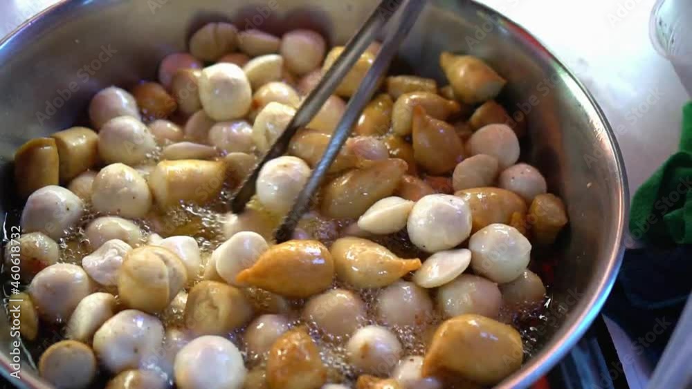 frying fish ball kikiam and squid ball with sweet and spicy sauce is a