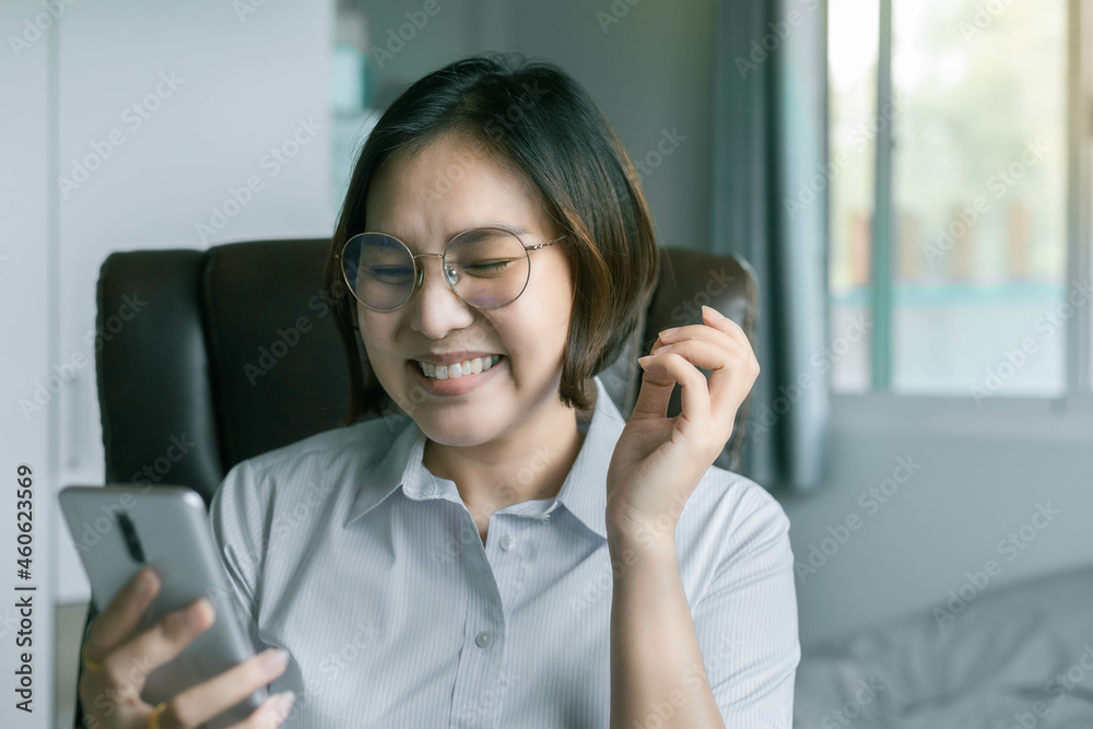 Working women express happiness and joy when they see results on their smartphones. Working women express happiness and joy when they see results on their smartphones.