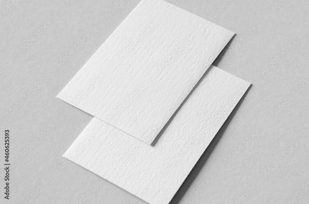 Textured business card mockup, vertical orientation. 55x85 mm.