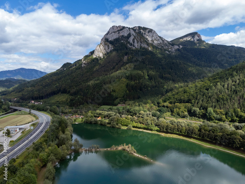 aerial view of bathing pond between freeway and mountain peak Roethelstein in Styria, Austria
 photo