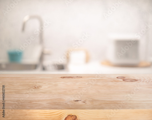 Selective focus/Wood table top on blur kitchen counter background.