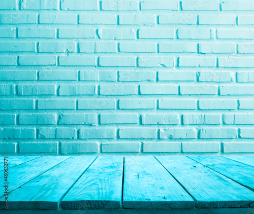 Selective focus/Colorful of wood table top with pstel brick background. photo
