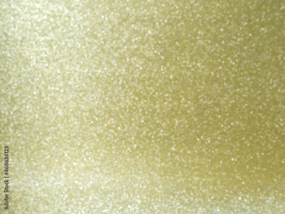 Golden glitter background with bokeh for festive holidays 