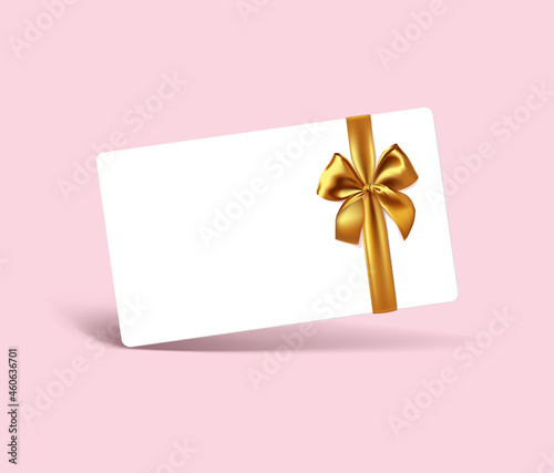 Blank white gift card with realistic gold ribbon bow