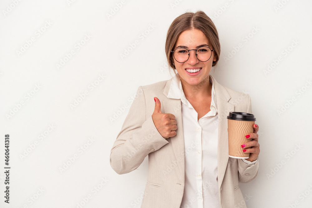 Young Russian business woman holding banknotes isolated on white background smiling and raising thumb up
