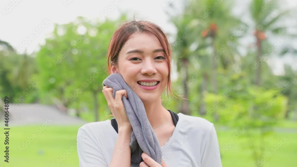 Asian active sport woman stand with confidence after exercise outdoors. Asian active sport woman stand with confidence after exercise outdoors.