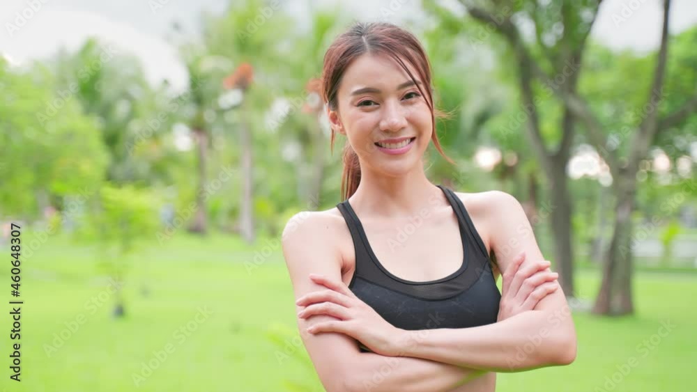 Asian active sport woman stand with confidence after exercise outdoors. Asian active sport woman stand with confidence after exercise outdoors.