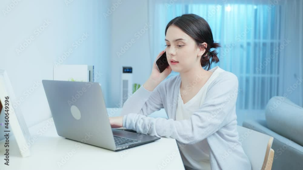 Asian young beautiful businesswoman working at home during night time. Asian young beautiful businesswoman working at home during night time.