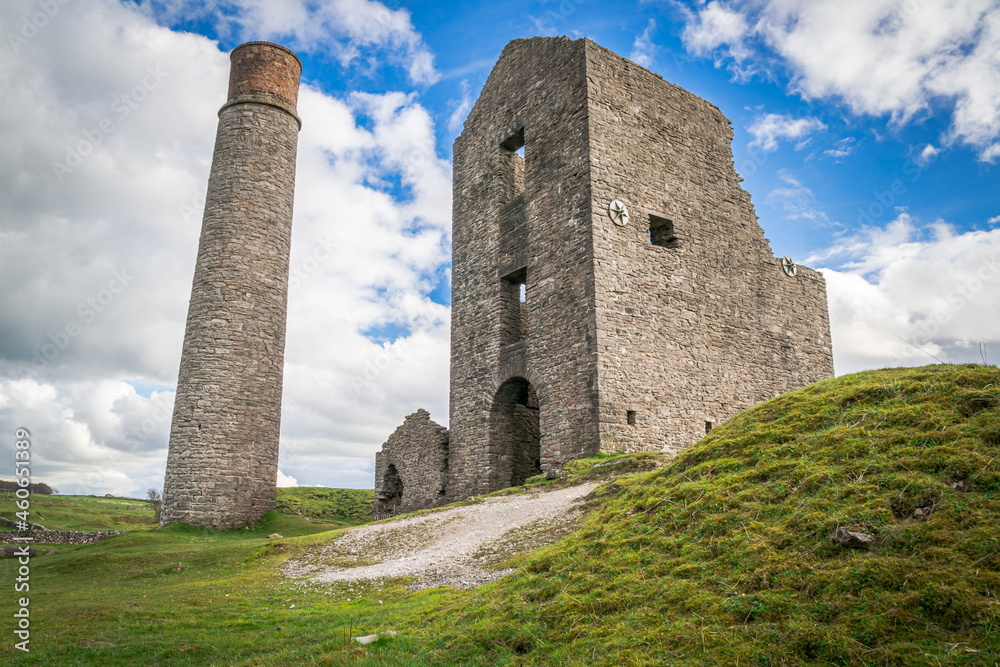 The Cornish engine house and circular chimney, at Magpie Mine, Sheldon, a preserved lead mine in the Peak District National Park
