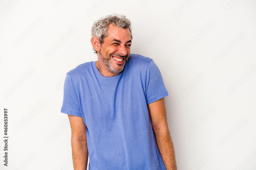 Middle age caucasian man isolated on white background laughs and closes eyes, feels relaxed and happy. Middle age caucasian man isolated on white background laughs and closes eyes, feels relaxed and happy.