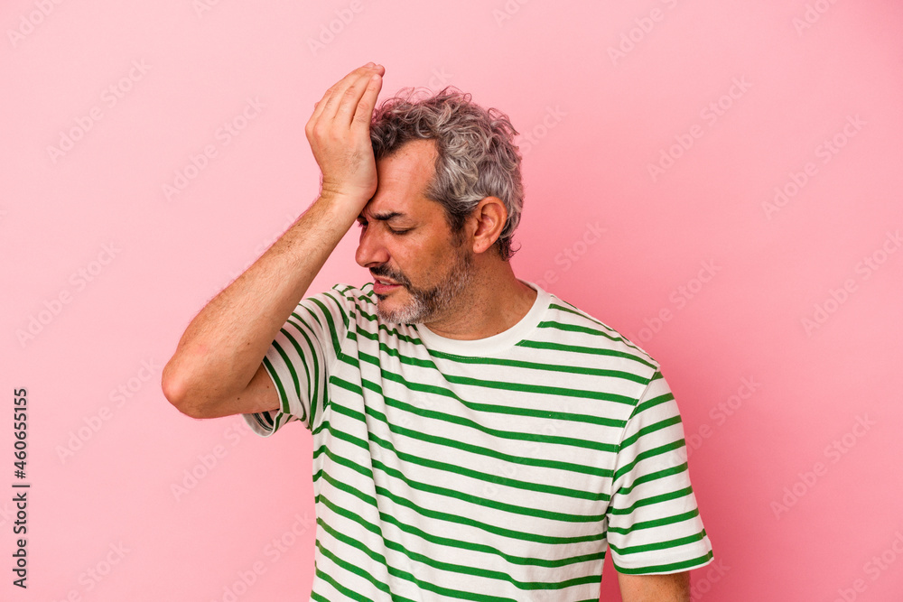 Middle age caucasian man isolated on pink background forgetting something, slapping forehead with palm and closing eyes. Middle age caucasian man isolated on pink background forgetting something, slapping forehead with palm and closing eyes.