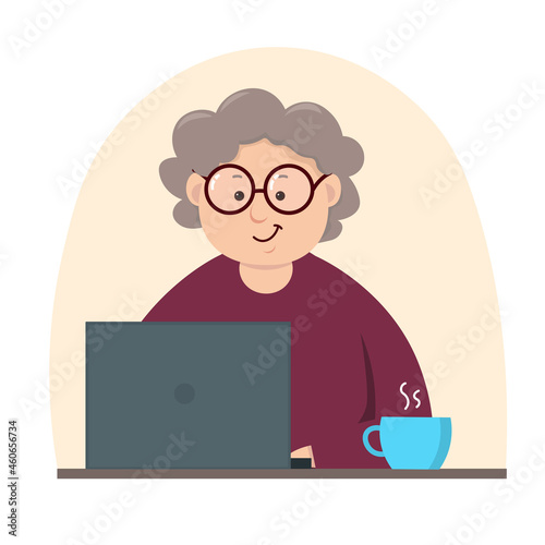Happy grandma working on laptop