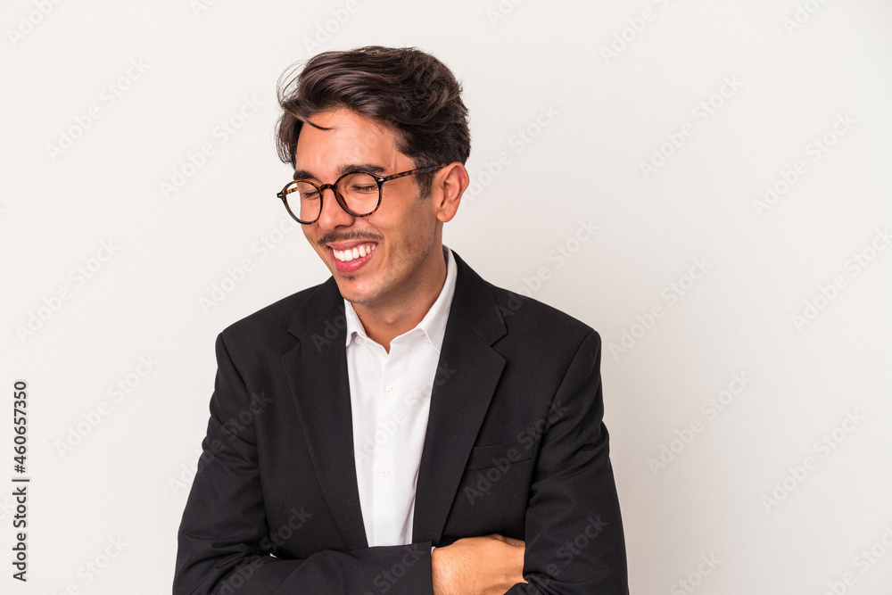 Young mixed race business man isolated on white background laughing and having fun. Young mixed race business man isolated on white background laughing and having fun.