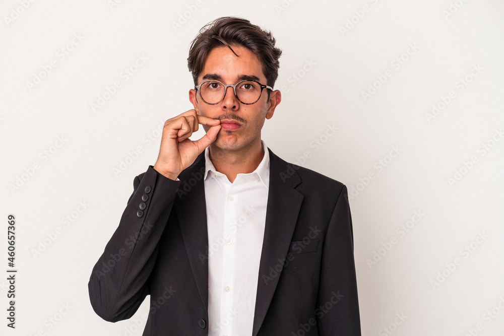 Young mixed race business man isolated on white background with fingers on lips keeping a secret. Young mixed race business man isolated on white background with fingers on lips keeping a secret.