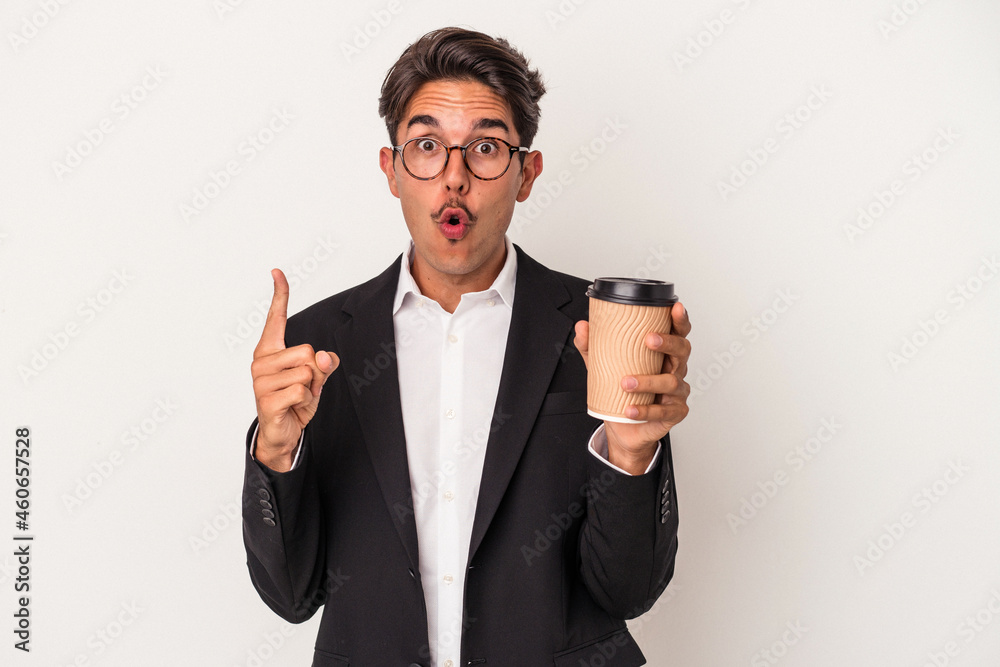 Young mixed race business man holding take away coffee isolated on white background having some great idea, concept of creativity. Young mixed race business man holding take away coffee isolated on white background having some great idea, concept of creativity.