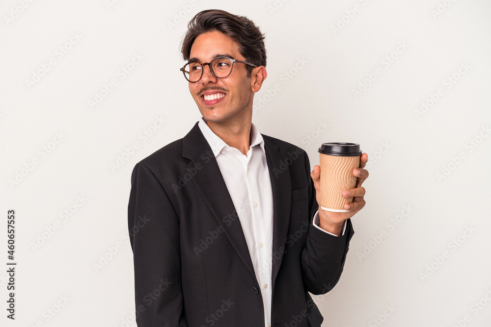 Young mixed race business man holding take away coffee isolated on white background looks aside smiling, cheerful and pleasant. Young mixed race business man holding take away coffee isolated on white background looks aside smiling, cheerful and pleasant.