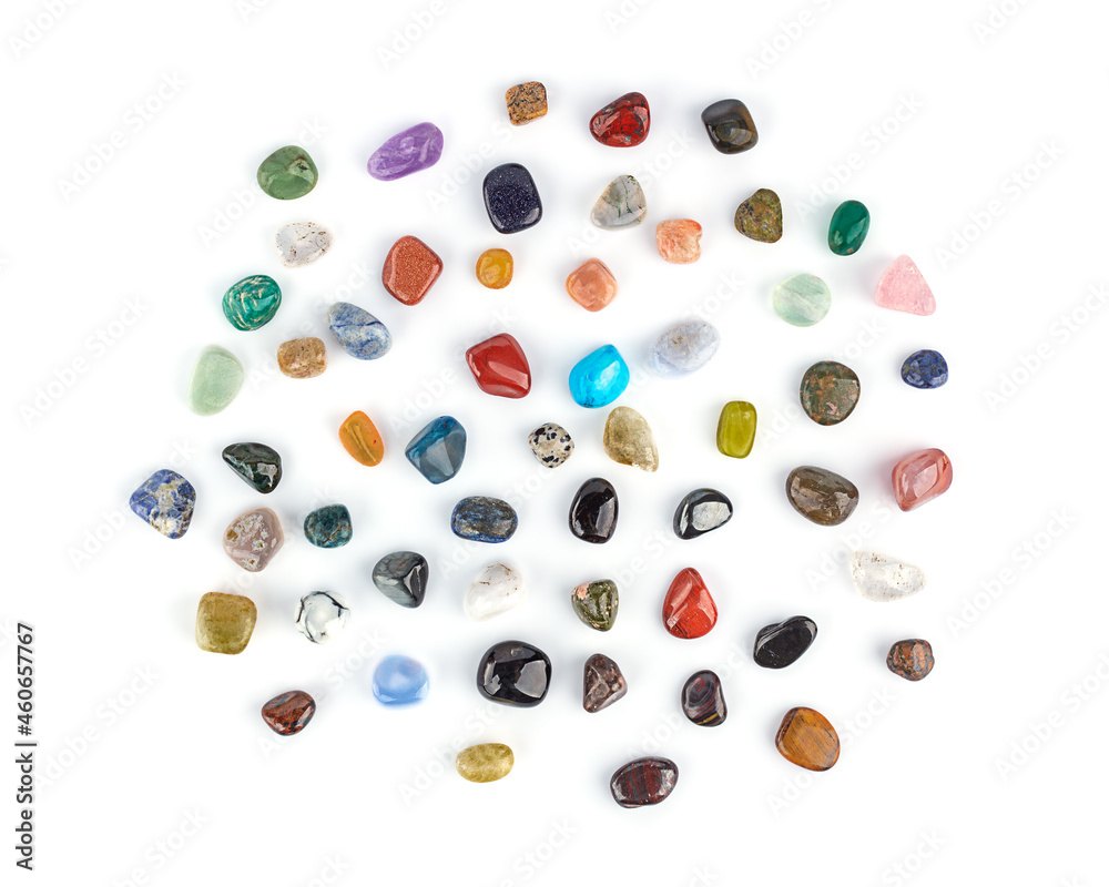 Collection of multicolored minerals and crystals on a white background isolated, top view close-up. Lithotherapy, chakra balancing, crystal ritual. Collection of multicolored minerals and crystals on a white background isolated, top view close-up. Lithotherapy, chakra balancing, crystal ritual.