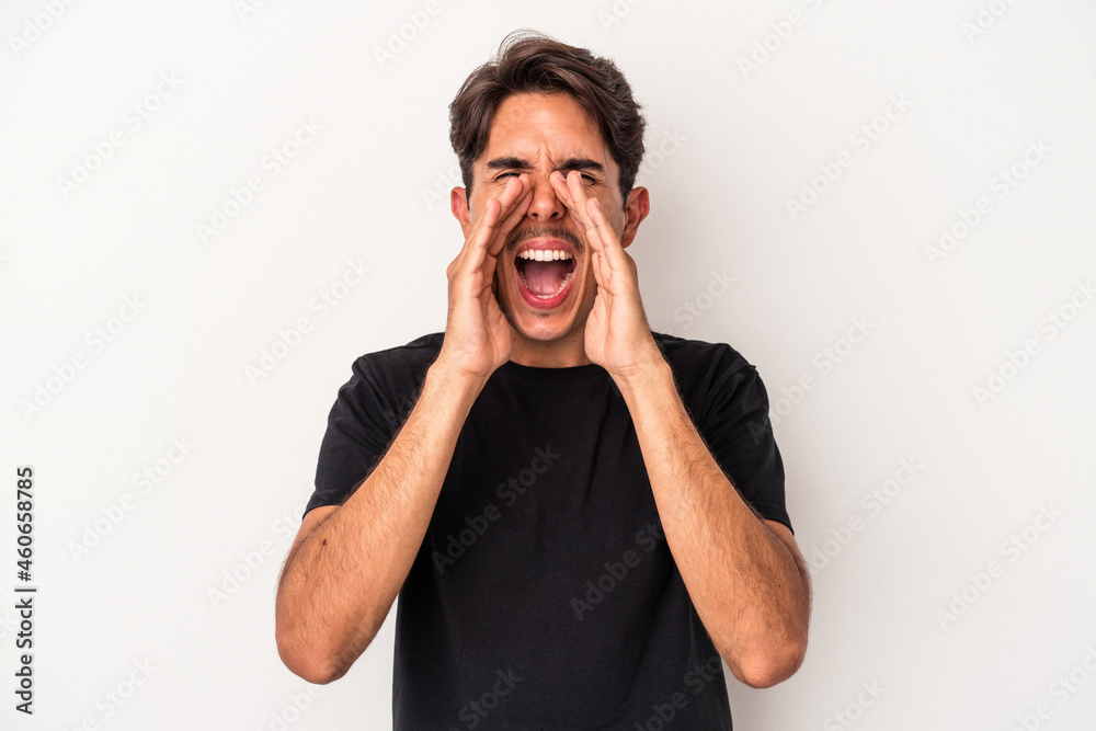 Young mixed race man isolated on white background shouting excited to front. Young mixed race man isolated on white background shouting excited to front.
