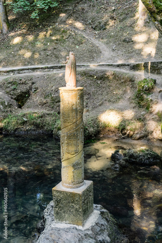 Source of the river Ebro with commemorative statue in the center, Fontibre, Cantabria, Spain photo