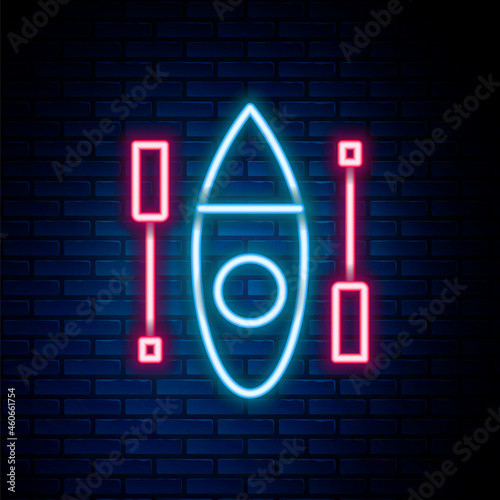 Glowing neon line Kayak and paddle icon isolated on brick wall background. Kayak and canoe for fishing and tourism. Outdoor activities. Colorful outline concept. Vector