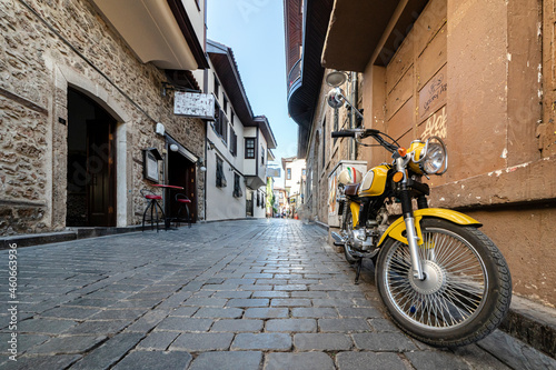 cozy streets of kaleichi in antalya motorcycle parked on an empty cozy street. peace and quiet in the historical center of Antalya in Turkey. travel and tourism
