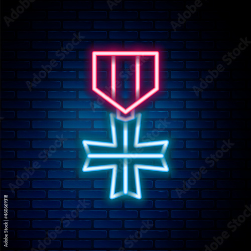 Glowing neon line Military reward medal icon isolated on brick wall background. Army sign. Colorful outline concept. Vector