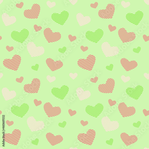 Seamless pattern of orange and green hearts on a light green background