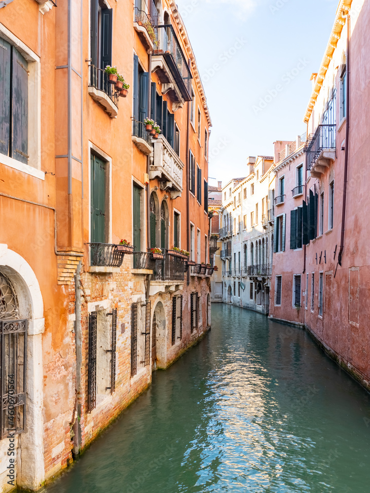 Venice in Italy in summer. Typical channel and architecture of the famous travel destination.