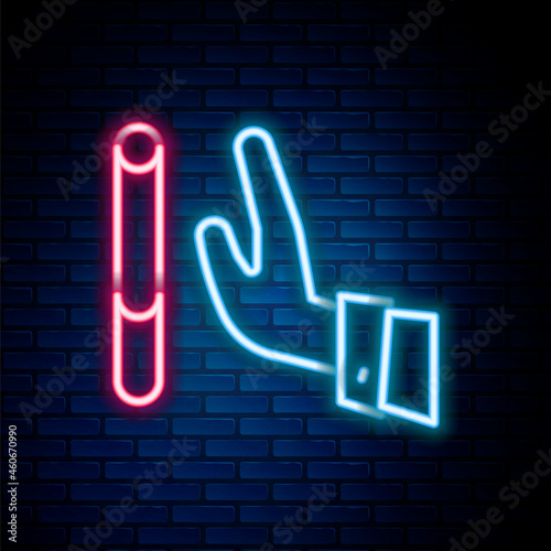 Glowing neon line Giving up cigarette icon isolated on brick wall background. Tobacco sign. Smoking symbol. Healthy lifestyle. Colorful outline concept. Vector