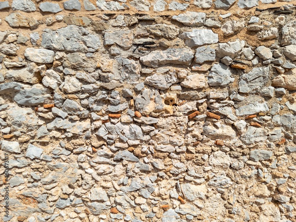 Old weathered exterior rough strong stone wall Old weathered exterior rough strong stone wall