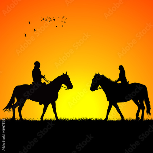 Silhouette of two riders on sunrise