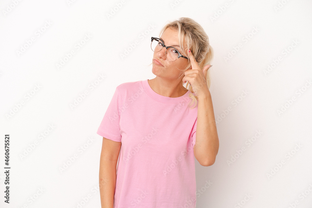 Young Russian woman isolated on white background pointing temple with finger, thinking, focused on a task. Young Russian woman isolated on white background pointing temple with finger, thinking, focused on a task.