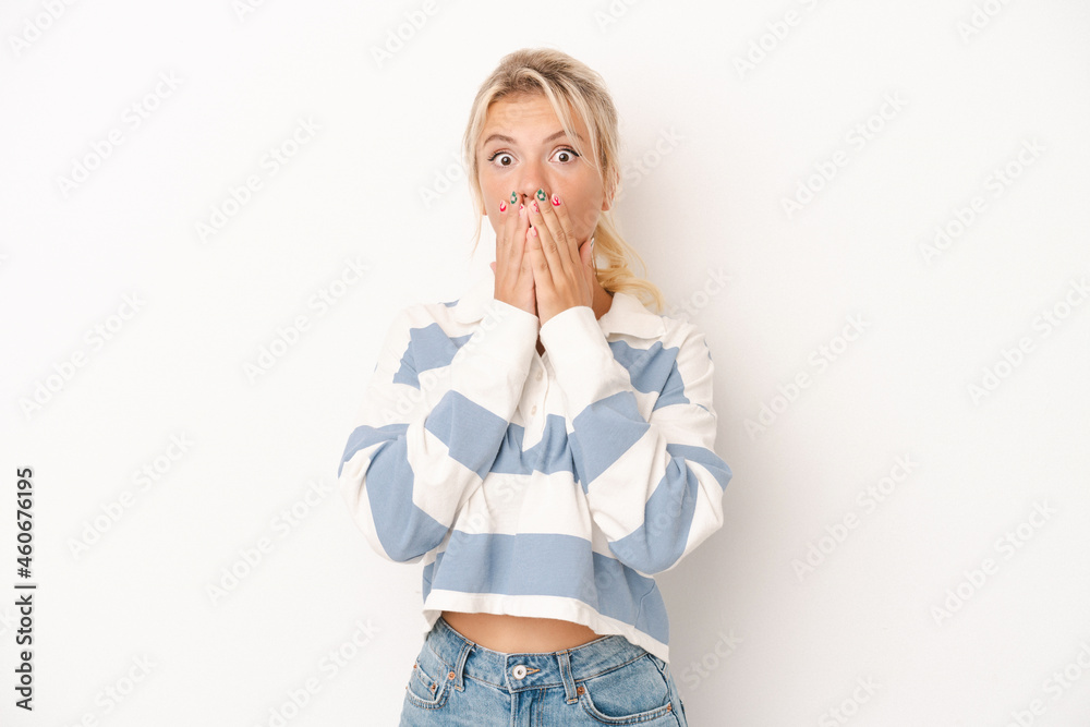 Young Russian woman isolated on white background shocked covering mouth with hands. Young Russian woman isolated on white background shocked covering mouth with hands.