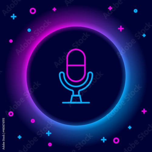 Glowing neon line Microphone voice device icon isolated on black background. Microphone interpreter and alphabet letters. Colorful outline concept. Vector